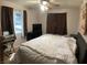 Comfortable bedroom with a large window and neutral wall tones at 400 National St, Henderson, NV 89015