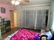 Bedroom featuring colorful walls, a closet and dresser, as well as a ceiling fan at 400 National St, Henderson, NV 89015