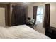 Bright bedroom featuring a workspace area with large window at 400 National St, Henderson, NV 89015