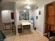 Cozy dining area with tile flooring, table with benches, and oak cabinets at 400 National St, Henderson, NV 89015