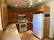 Functional kitchen with oak cabinets, tile floors and an oven at 400 National St, Henderson, NV 89015