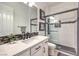 Stylish bathroom featuring glass-enclosed shower, modern vanity, and contemporary finishes at 409 Lake Windemere St, Las Vegas, NV 89138