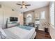 Tranquil bedroom featuring hardwood floors, a cozy armchair, and abundant natural light at 409 Lake Windemere St, Las Vegas, NV 89138