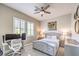 Cozy bedroom with plush carpet, neutral tones, and a ceiling fan at 409 Lake Windemere St, Las Vegas, NV 89138