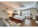 Spacious bedroom boasts hardwood floors, a ceiling fan, and ample natural light from the plantation shutters at 409 Lake Windemere St, Las Vegas, NV 89138