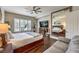 This relaxing bedroom features a large mirror, neutral walls and a ceiling fan, perfect for unwinding at 409 Lake Windemere St, Las Vegas, NV 89138