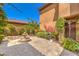 Charming courtyard showcasing brick pavers, a fountain, mature trees and lush greenery at 409 Lake Windemere St, Las Vegas, NV 89138
