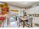 Bright dining area features backyard access, modern lighting, and seamlessly connects to the kitchen at 409 Lake Windemere St, Las Vegas, NV 89138