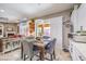 Charming dining area with modern chandelier, slider to the patio, and stylish décor at 409 Lake Windemere St, Las Vegas, NV 89138
