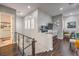 Upstairs hallway featuring hardwood floors, natural lighting, and built-in desk space at 409 Lake Windemere St, Las Vegas, NV 89138