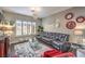 Stylish living room boasts a large leather sofa, modern lighting, and decorative wall art at 409 Lake Windemere St, Las Vegas, NV 89138