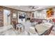 Spacious living area with stone accent wall, fireplace, built-in shelving, and large leather seating at 409 Lake Windemere St, Las Vegas, NV 89138