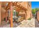 Charming patio area with a wooden pergola provides a cozy outdoor dining space and relaxing ambiance at 409 Lake Windemere St, Las Vegas, NV 89138