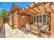 Inviting covered patio, featuring comfortable seating and stylish decor for relaxing or entertaining al fresco at 409 Lake Windemere St, Las Vegas, NV 89138