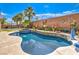 Relaxing backyard boasting a refreshing swimming pool, patio area, and thoughtfully designed landscaping for outdoor enjoyment at 409 Lake Windemere St, Las Vegas, NV 89138