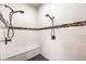 Modern shower stall features a bench, stylish tilework, and dual shower heads for a spa-like experience at 409 Lake Windemere St, Las Vegas, NV 89138