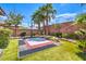 Backyard featuring a multi-purpose sport court alongside lush greenery for active recreation and outdoor fun at 409 Lake Windemere St, Las Vegas, NV 89138
