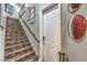 Beautiful staircase with tiled steps, iron railing, and decorative wall accents at 409 Lake Windemere St, Las Vegas, NV 89138