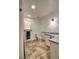 Bright bathroom featuring a toilet, granite-top vanity, and tiled flooring under recessed lighting at 4211 Bradley Rd, Las Vegas, NV 89130