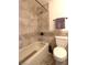 Well-lit bathroom featuring a bathtub and tiled shower area with modern fixtures and a neutral color palette at 4211 Bradley Rd, Las Vegas, NV 89130