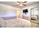 Bedroom featuring carpet, tv, and a ceiling fan at 4211 Bradley Rd, Las Vegas, NV 89130