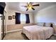 Bedroom with a ceiling fan, carpet floors and large window at 4211 Bradley Rd, Las Vegas, NV 89130