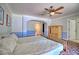 Bedroom with a bed, ceiling fan, cabinet and adjoining bathroom at 4211 Bradley Rd, Las Vegas, NV 89130
