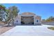 A detached garage with wide opening showing the interior, offering ample space for storage or workshop at 4211 Bradley Rd, Las Vegas, NV 89130
