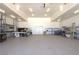 A spacious garage with lots of shelving and workbenches, offering ample room for storage and projects at 4211 Bradley Rd, Las Vegas, NV 89130