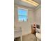 A basic utility bathroom features a sink, toilet, and storage cabinet, providing essential facilities at 4211 Bradley Rd, Las Vegas, NV 89130
