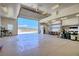 Spacious garage interior featuring a smooth concrete floor, shelving, and ample workspace at 4211 Bradley Rd, Las Vegas, NV 89130