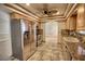 Modern kitchen featuring stainless steel appliances, granite countertops, and tiled floor at 4211 Bradley Rd, Las Vegas, NV 89130