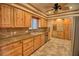 Kitchen showcases stainless steel appliances, knotty wood cabinets, and granite countertops at 4211 Bradley Rd, Las Vegas, NV 89130