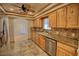 Beautiful kitchen with knotty wood cabinets, granite counters, and stainless-steel appliances at 4211 Bradley Rd, Las Vegas, NV 89130