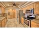 Well-equipped kitchen featuring stainless steel appliances and ample wood cabinetry at 4211 Bradley Rd, Las Vegas, NV 89130