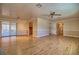 Expansive living room with hardwood floors, sliding glass doors, and seamless kitchen access at 4211 Bradley Rd, Las Vegas, NV 89130