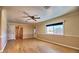 Spacious living room featuring gorgeous laminate flooring, trim, and ample natural light at 4211 Bradley Rd, Las Vegas, NV 89130