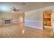 Spacious living room featuring a fireplace, hardwood floors, and an open layout at 4211 Bradley Rd, Las Vegas, NV 89130