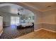 Open living space with wood floors, a ceiling fan, and sliding door to backyard at 4211 Bradley Rd, Las Vegas, NV 89130