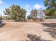 The backyard is large and private, thanks to mature trees and a block wall for enhanced privacy at 4620 Pacer Ave, North Las Vegas, NV 89031