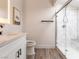 Modern bathroom with marble shower, white vanity, and stylish finishes, offering a luxurious experience at 4620 Pacer Ave, North Las Vegas, NV 89031