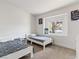 Bright bedroom featuring two beds and a window with natural light at 4620 Pacer Ave, North Las Vegas, NV 89031
