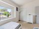 Cozy bedroom showcasing a window with natural light and a functional closet at 4620 Pacer Ave, North Las Vegas, NV 89031