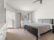 Bright bedroom featuring a ceiling fan, and a crib next to a window at 4620 Pacer Ave, North Las Vegas, NV 89031