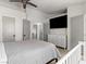 Bright bedroom featuring a ceiling fan, TV, closet, and carpeted floors at 4620 Pacer Ave, North Las Vegas, NV 89031