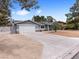 Single story home with a long driveway, attached garage, and xeriscaped front yard at 4620 Pacer Ave, North Las Vegas, NV 89031