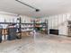 Spacious garage with overhead lighting and shelving, providing ample storage for organization at 4620 Pacer Ave, North Las Vegas, NV 89031