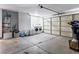 Well-lit garage with a washer, dryer, water heater, and ample space for parking and storage at 4620 Pacer Ave, North Las Vegas, NV 89031