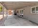 Covered patio with concrete flooring, offering a versatile outdoor space for relaxation and entertainment at 4620 Pacer Ave, North Las Vegas, NV 89031