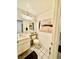 This bathroom has neutral walls, tile flooring, and artwork on the walls at 4662 Kelly Barry Way, Las Vegas, NV 89121